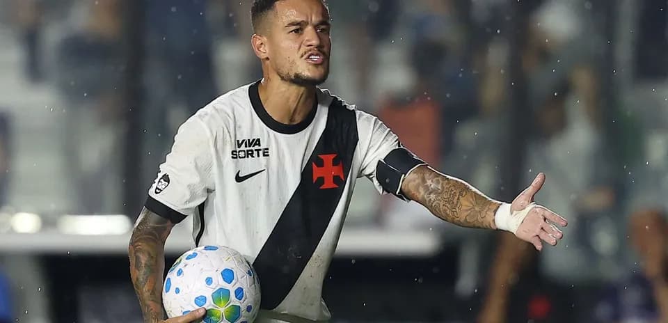 Player gesturing while holding a soccer ball