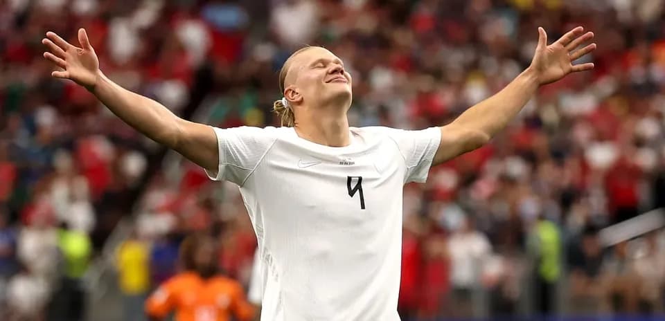 Player celebrating with arms outstretched on field