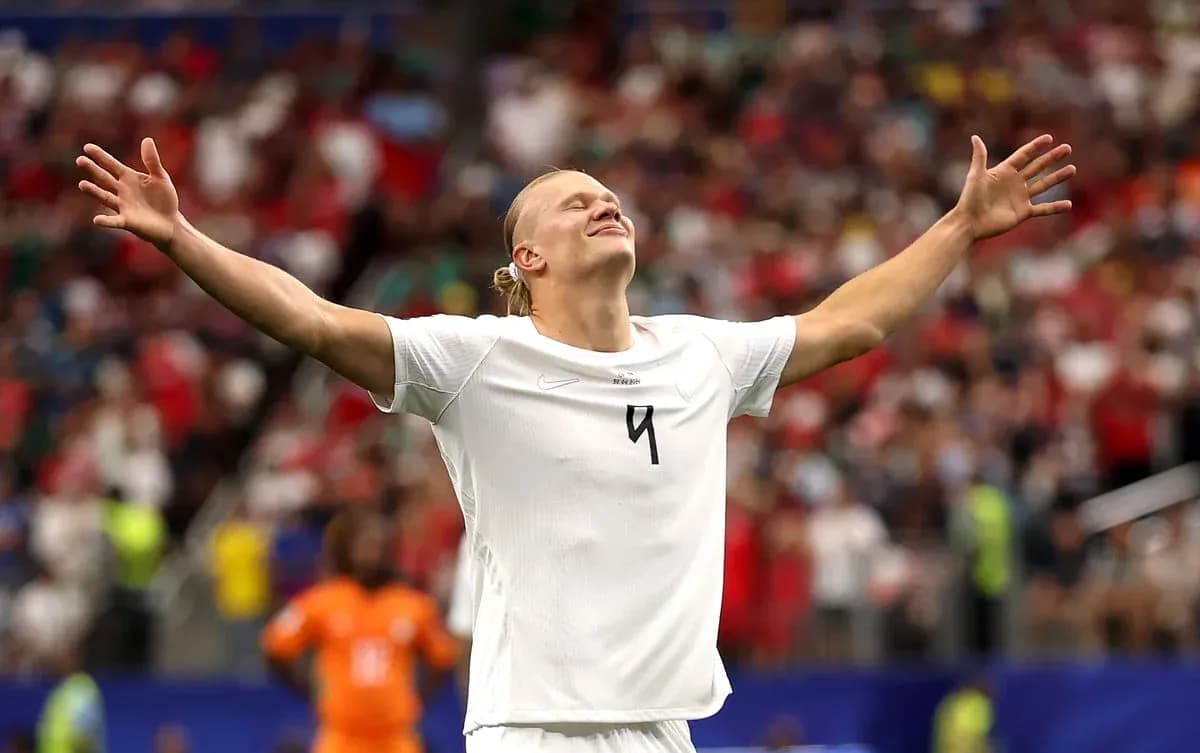 Player celebrating with arms outstretched on field