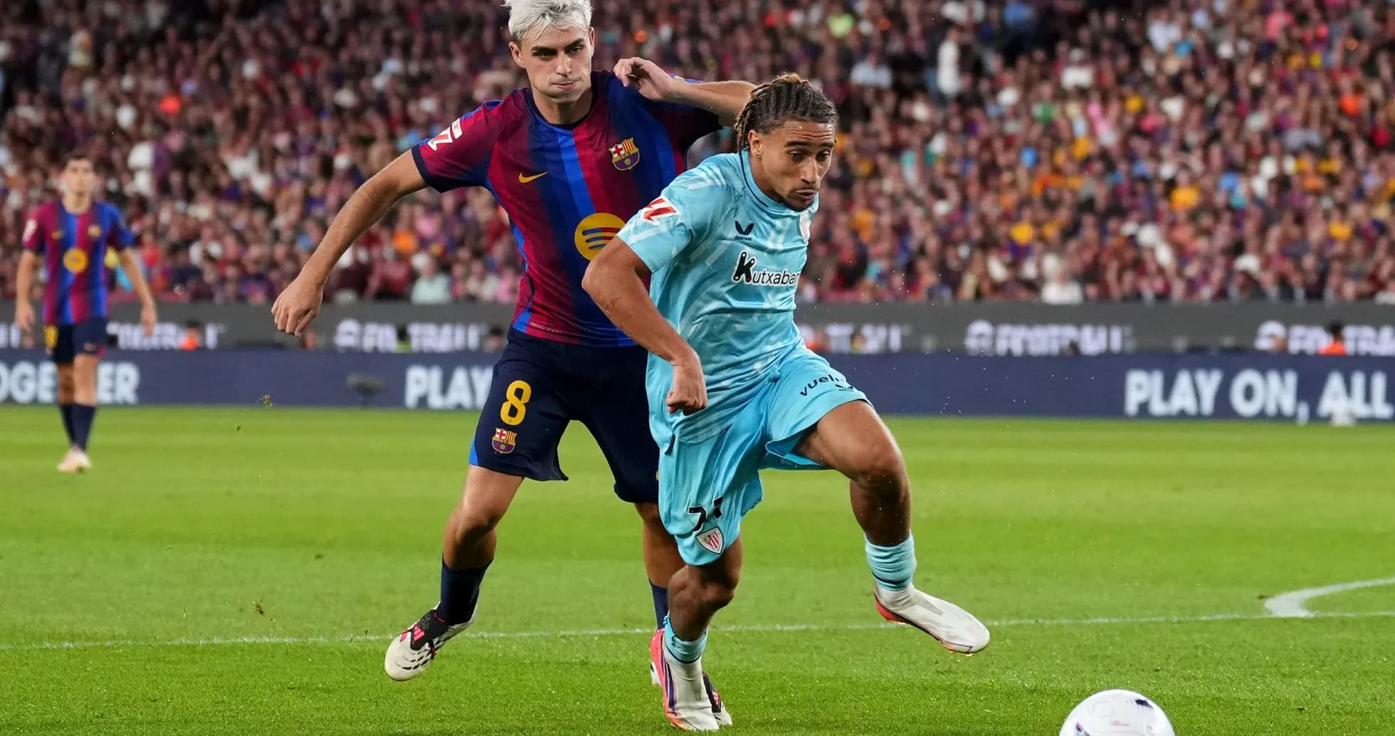 Player from Barcelona tackling opponent during match