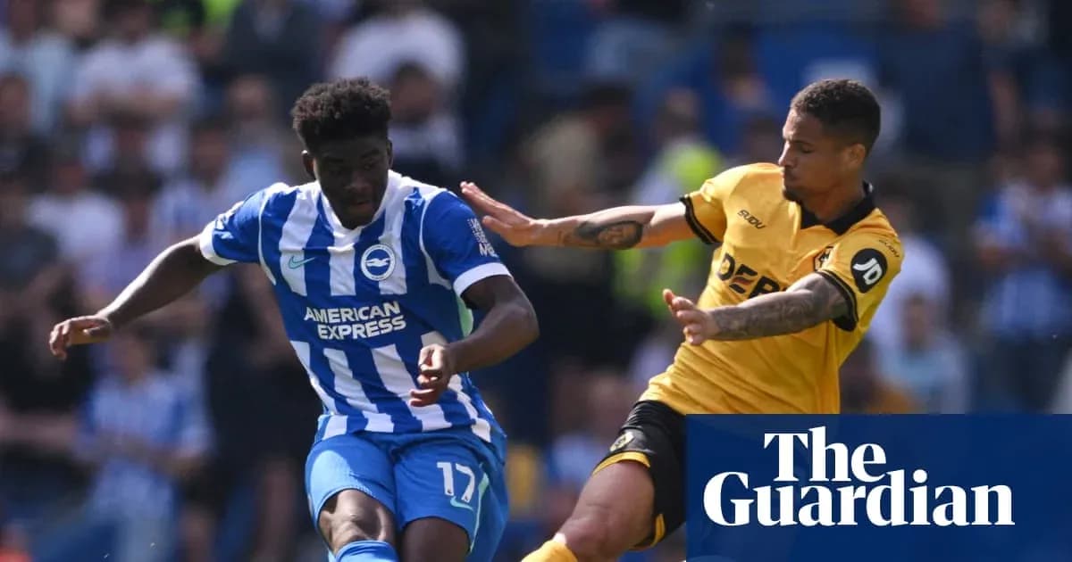 Brighton player evading challenge from opposing player