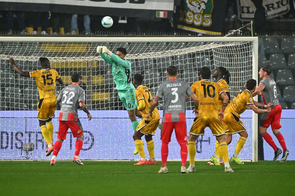 Goalkeeper catching the ball during Udinese match
