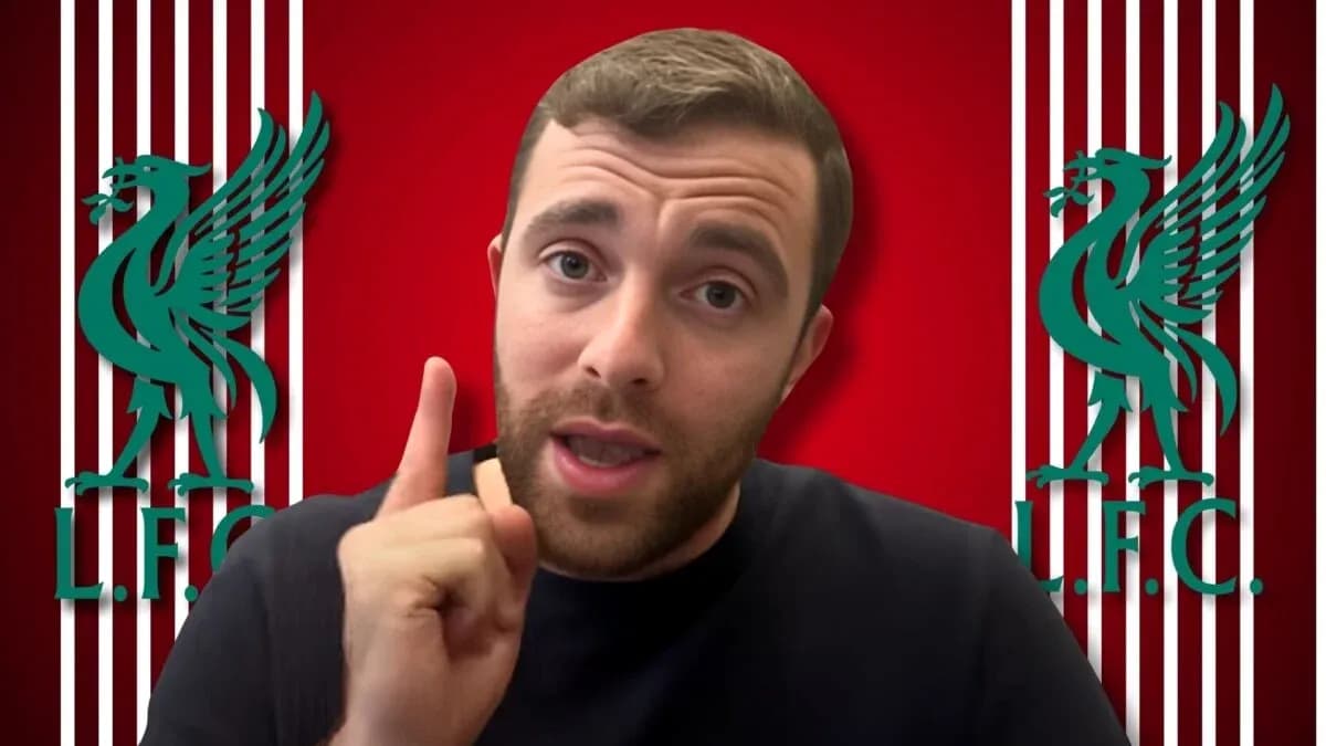 Person speaking with Liverpool FC logo in background