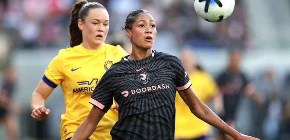 Player in black jersey controls the ball