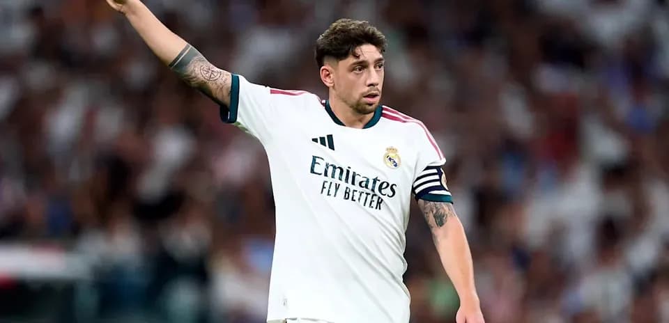 Player gesturing during match in Real Madrid uniform