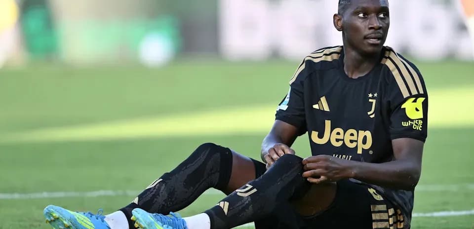 Juventus player sitting on the field during match
