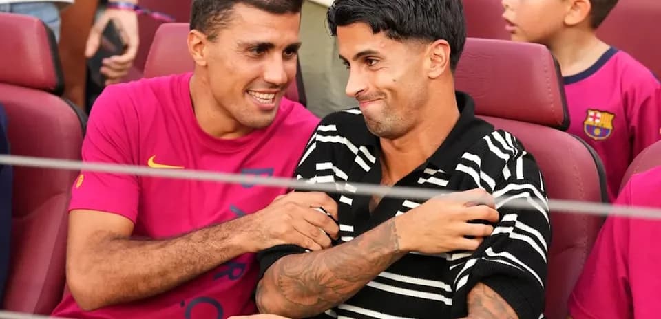 Two players chatting in stadium seats during event