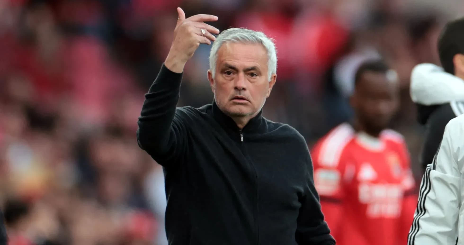 Coach gesturing during a football match