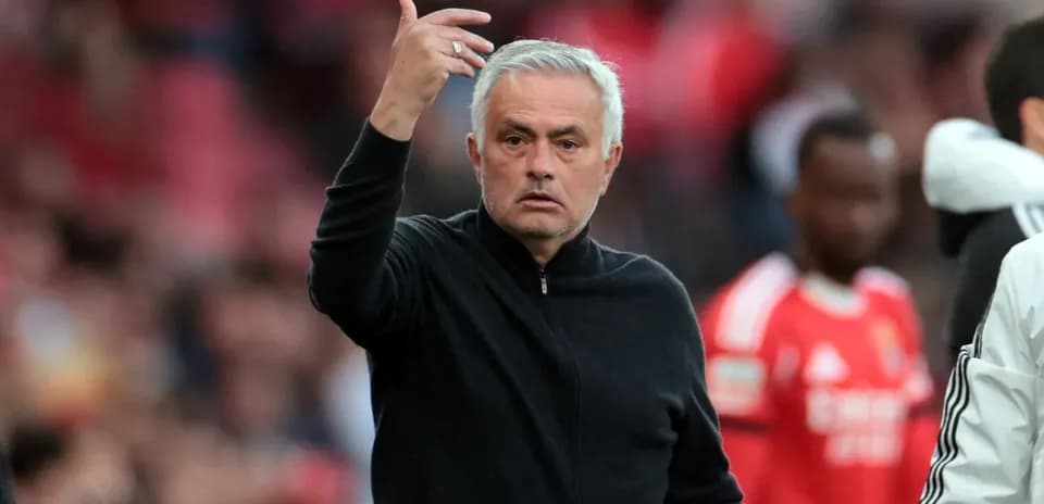 Coach gesturing during a football match