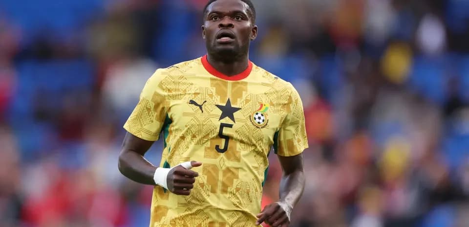 Ghanaian player in yellow jersey during match