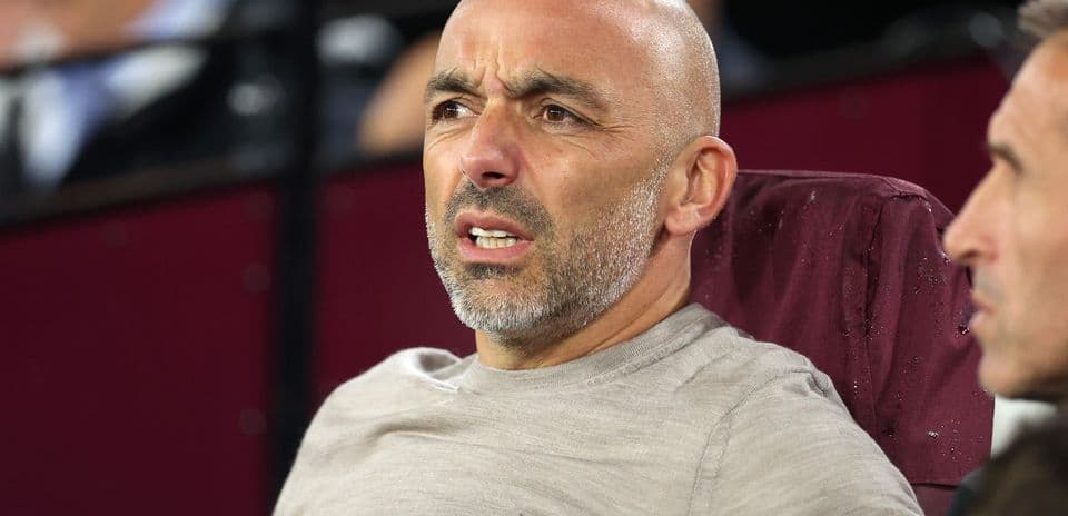 Coach observing the match from the sidelines