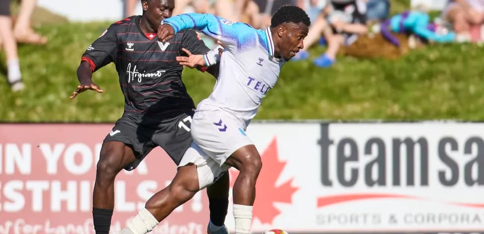 Player from Pacific FC dribbling against Vancouver FC