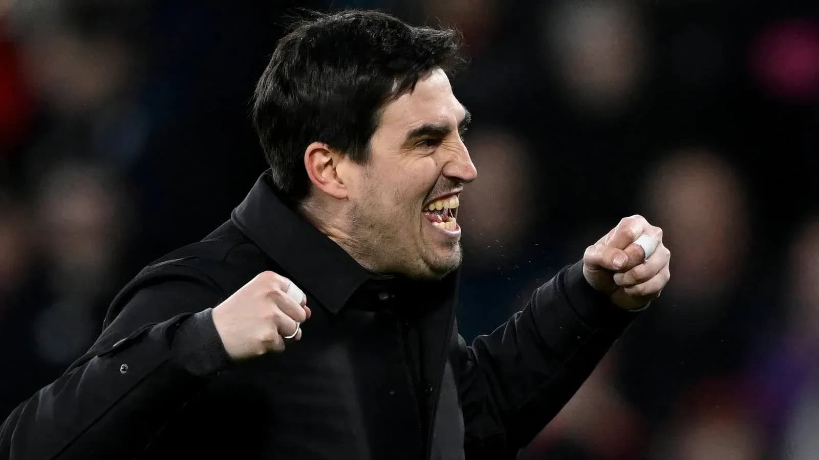 Coach celebrating passionately during match