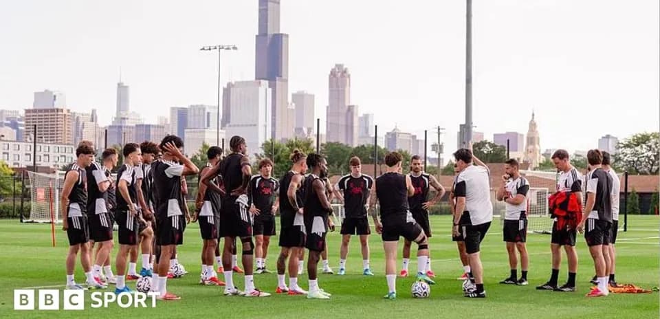 Soccer team gathered for discussion during training session