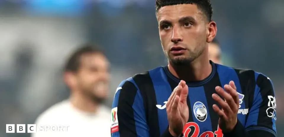 Player applauding fans after match wearing Atalanta jersey