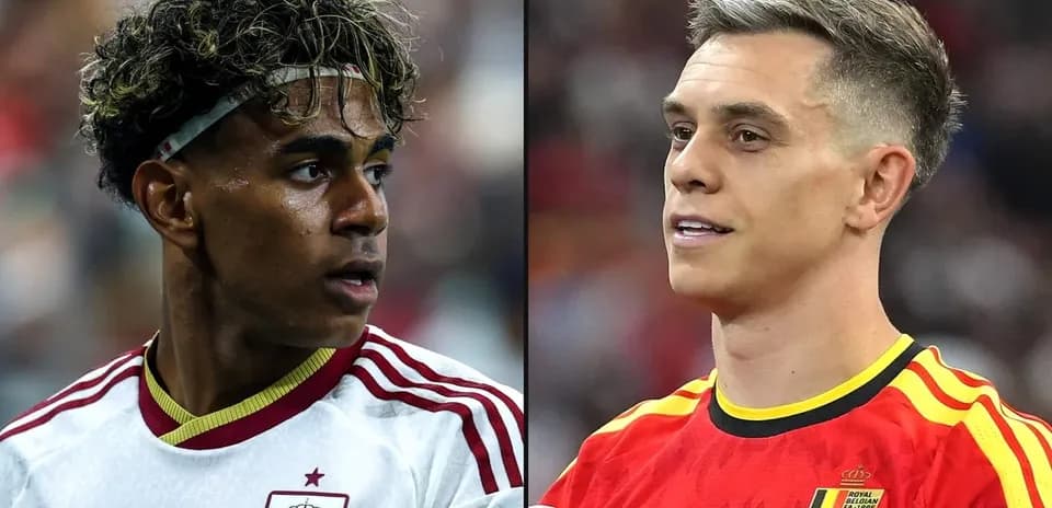 Two soccer players in national team jerseys