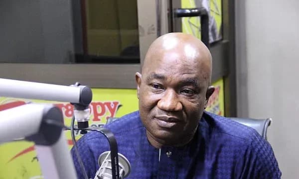 Person speaking during a radio interview in studio