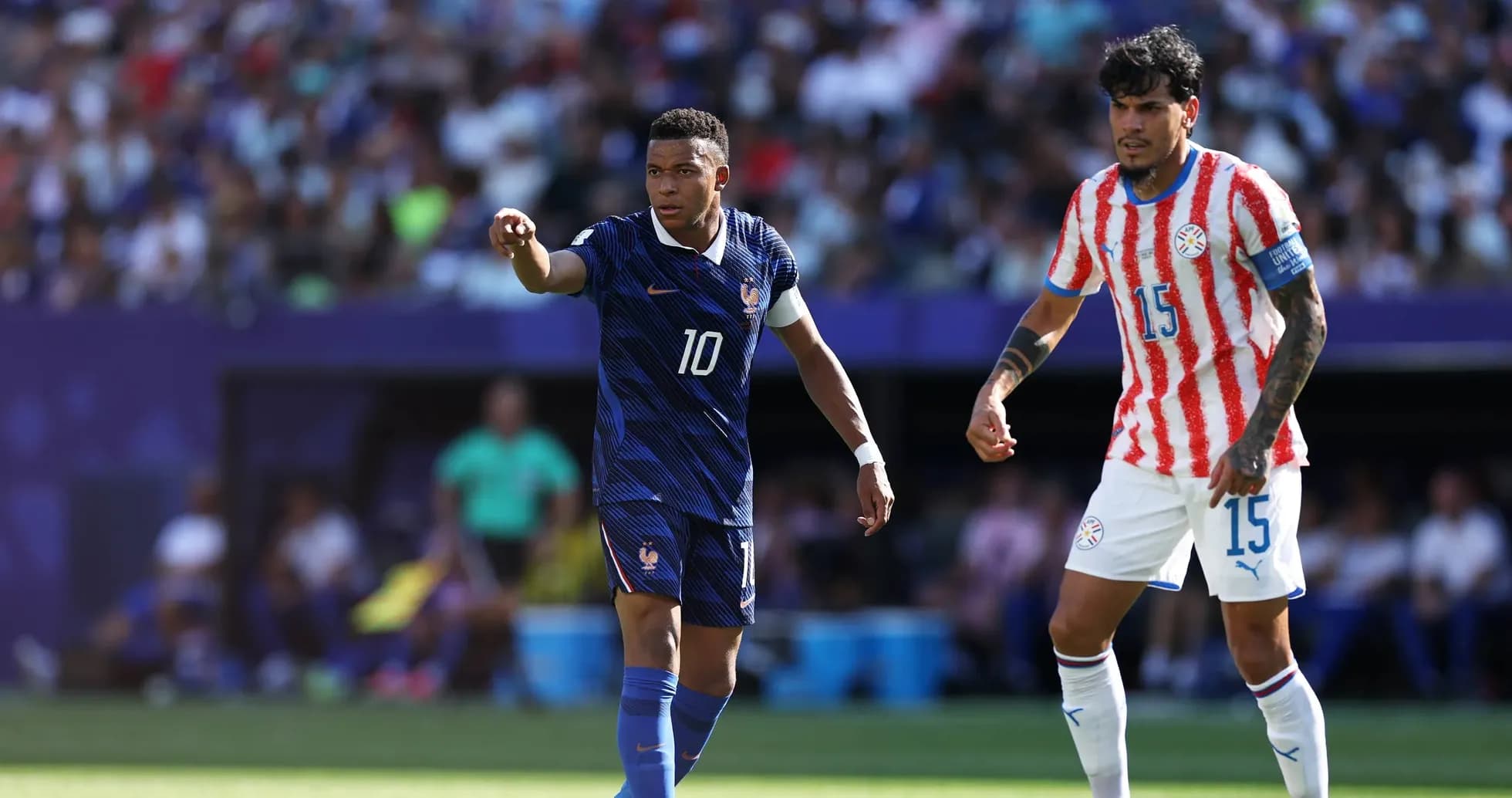 Mbappe and Paraguayan player during football match