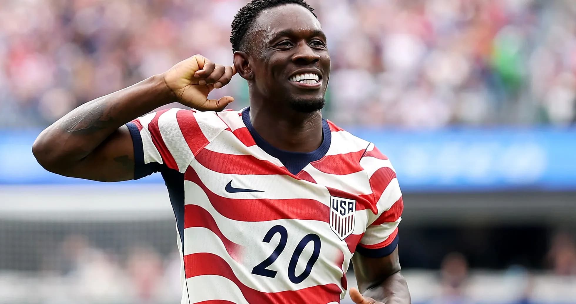 Player celebrating wearing USA jersey during match