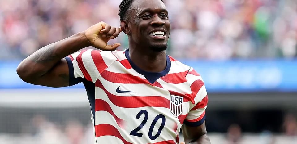 Player celebrating wearing USA jersey during match
