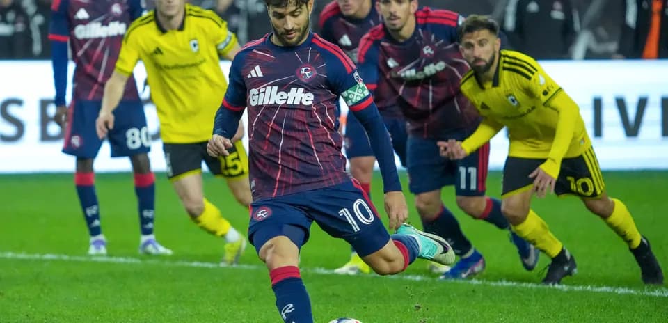 Player taking a penalty kick during match