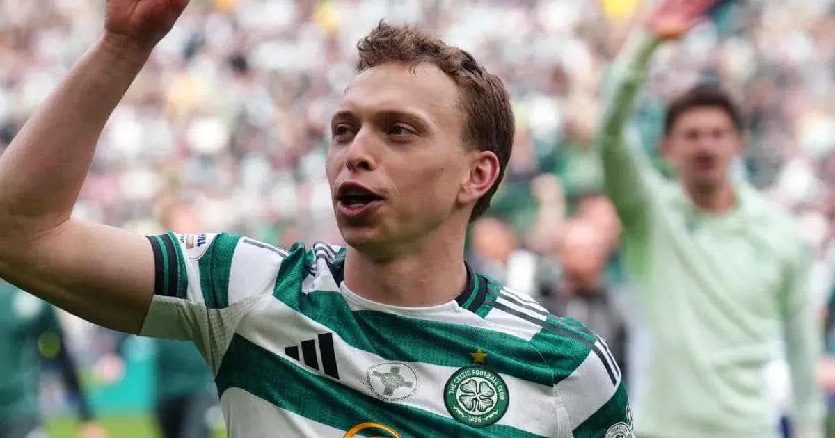 Celtic player celebrating in front of fans