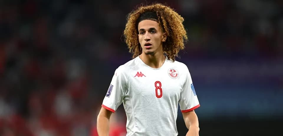 Player wearing Tunisia jersey during match action