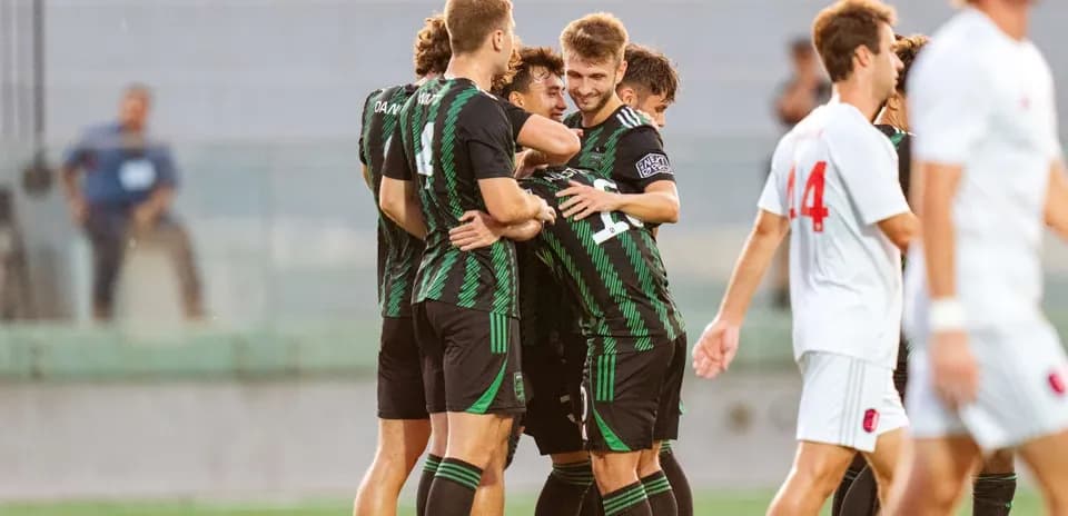 Players celebrating a goal during match