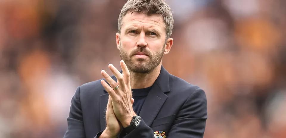 Coach clapping during match on the sidelines