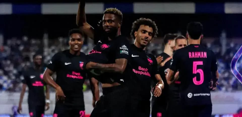 Players celebrating a goal during KuPS match