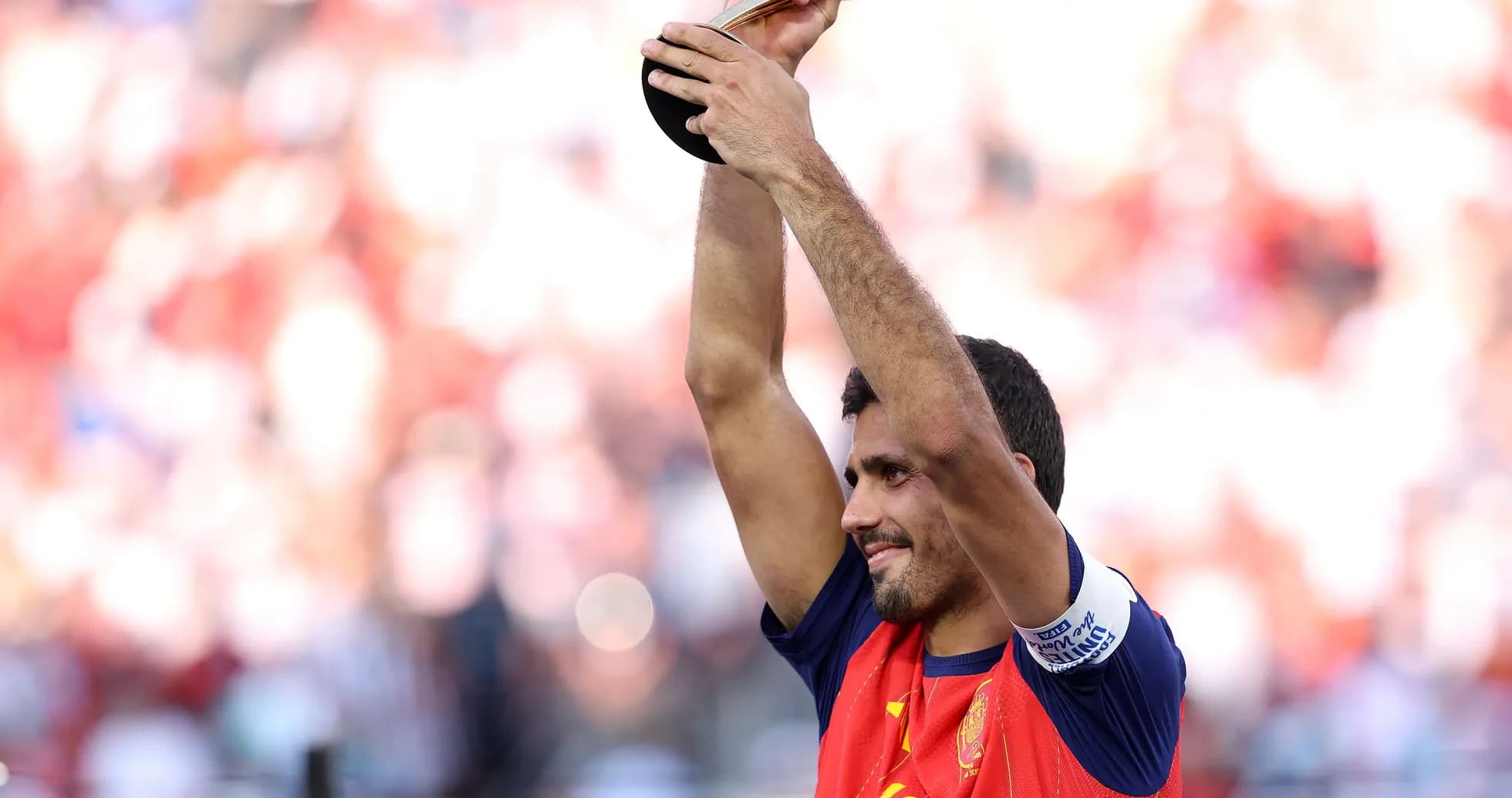 Player celebrating with trophy after victory