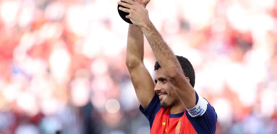 Player celebrating with trophy after victory
