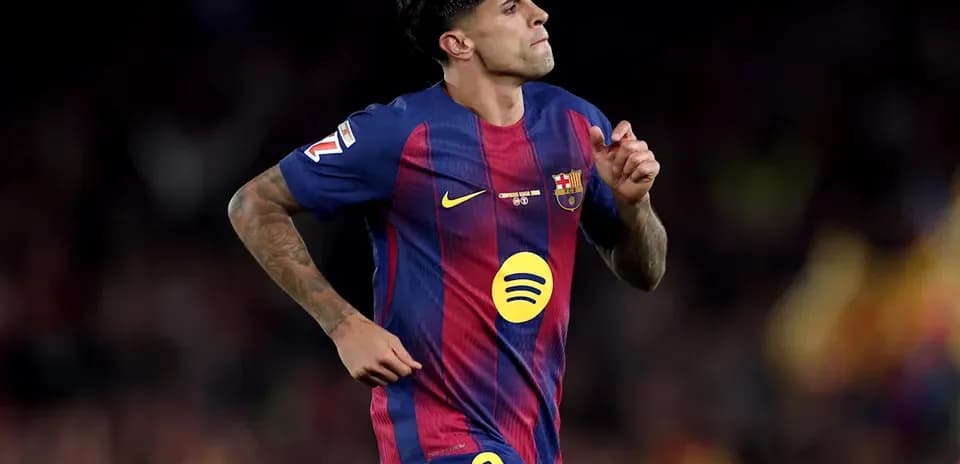 Player in FC Barcelona kit running on field
