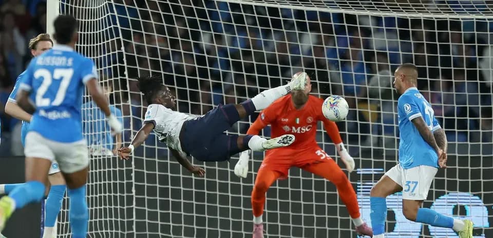 Player attempting acrobatic shot on goal
