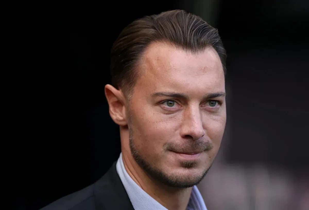 Man in a suit looking towards the camera