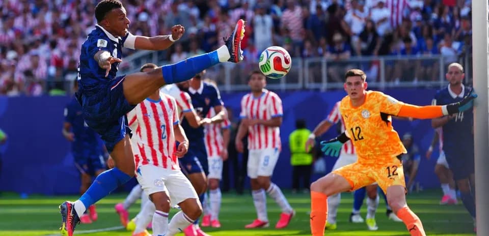 Player kicking ball during a tense match moment