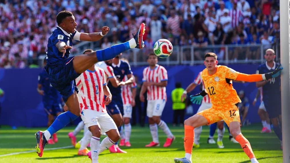 Player kicking ball during a tense match moment
