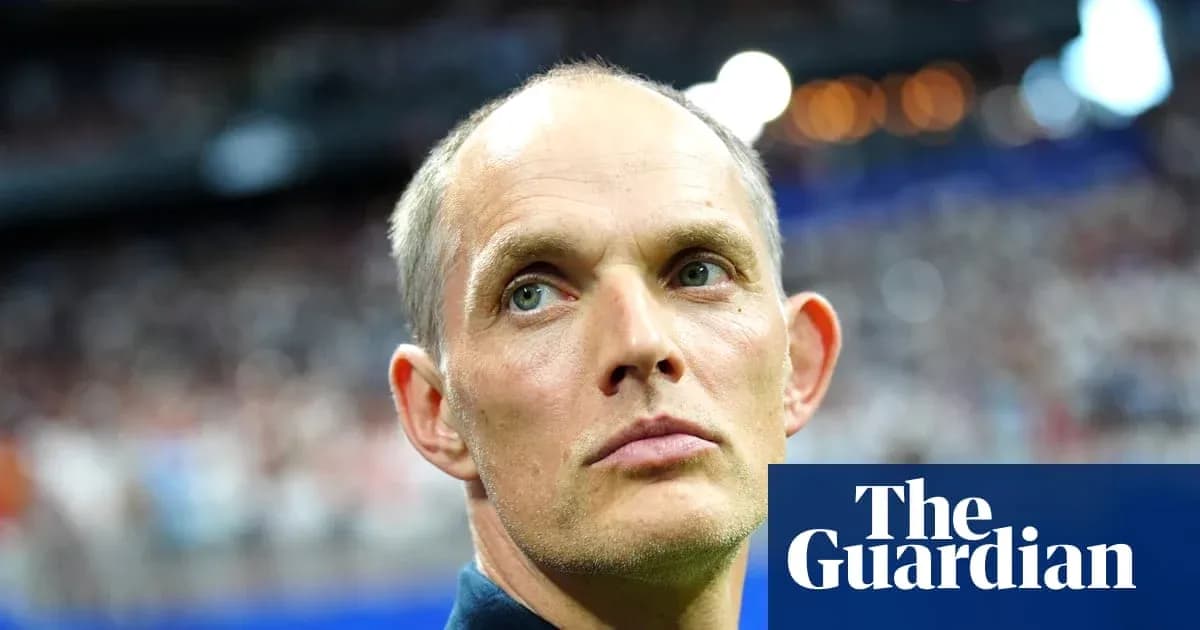 Coach observing match with focused expression