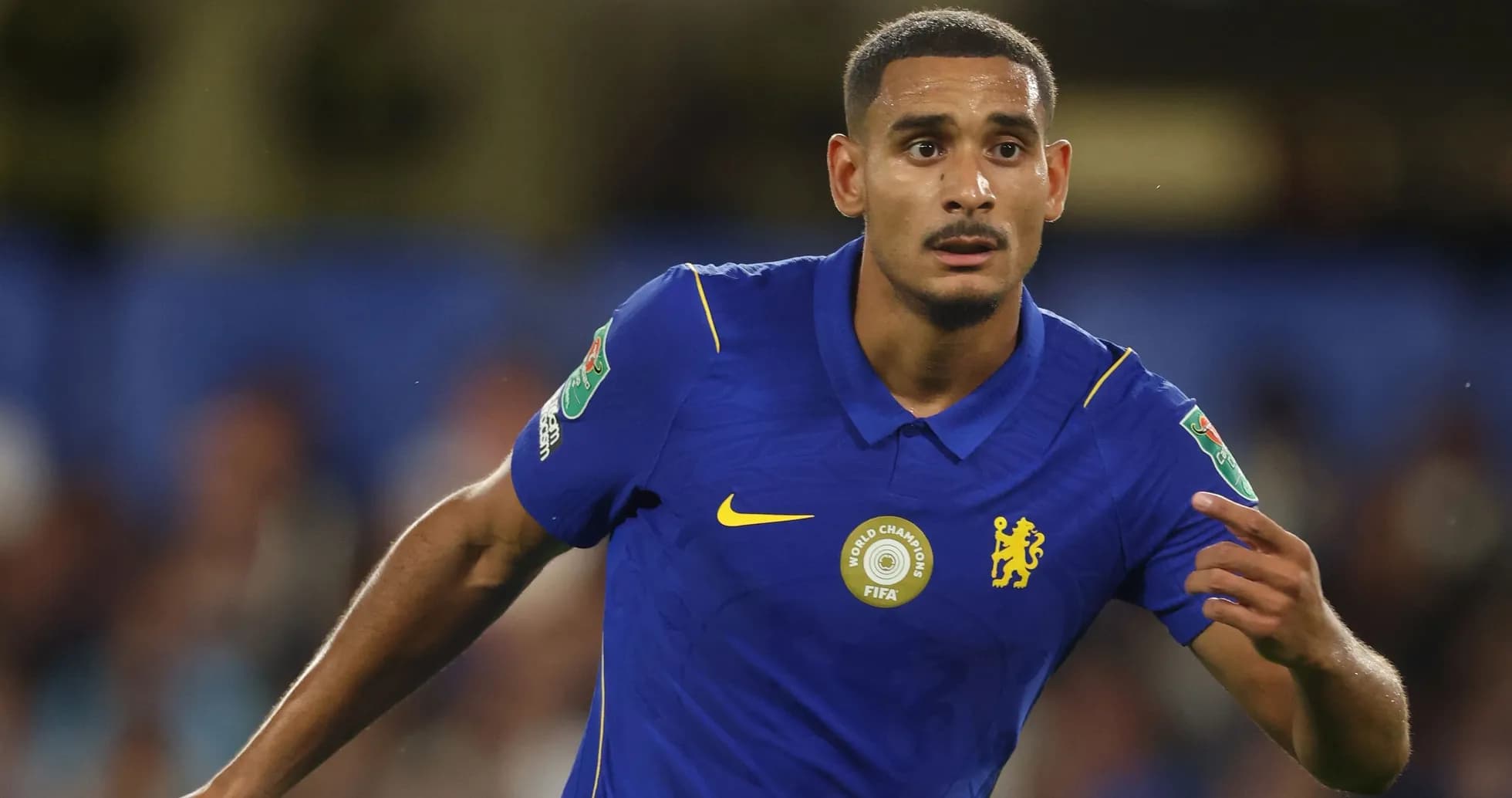Player in blue kit during a football match