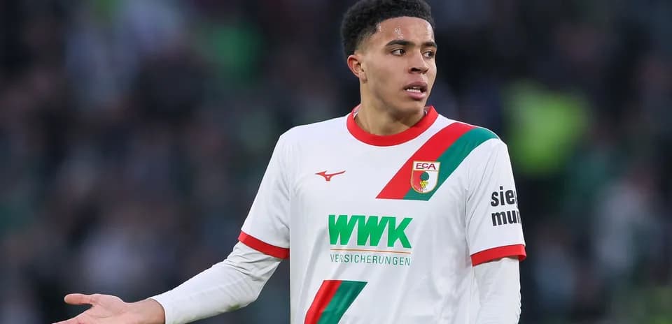 Player in Augsburg jersey gesturing during match