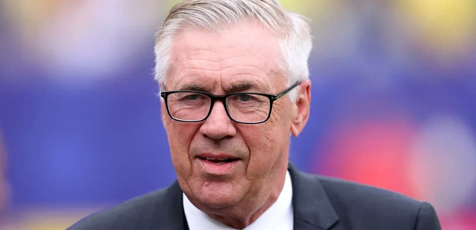 Coach with glasses at a sports event