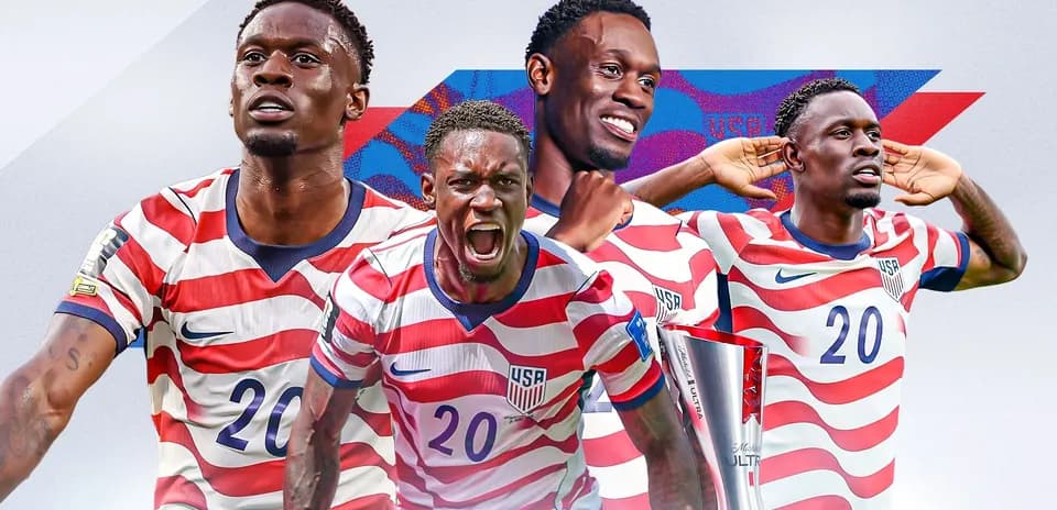 Player celebrating with trophy in USA jersey