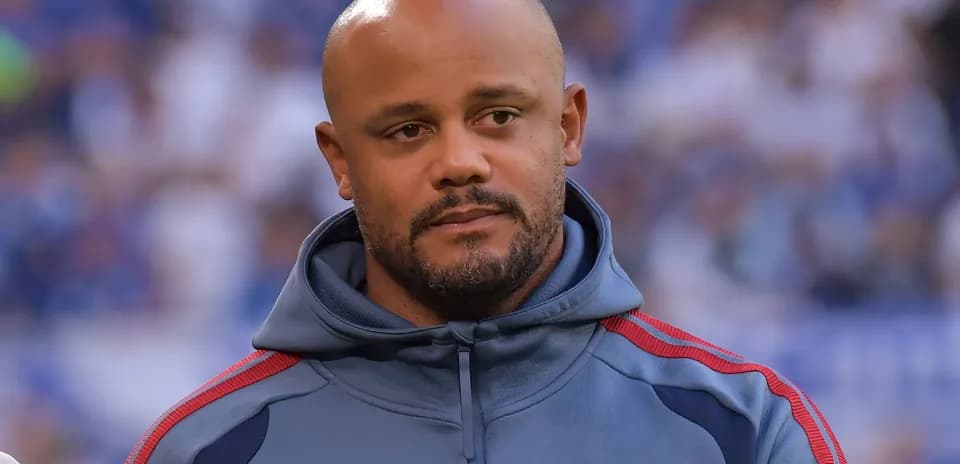 Coach in FC Bayern Munich hoodie on field