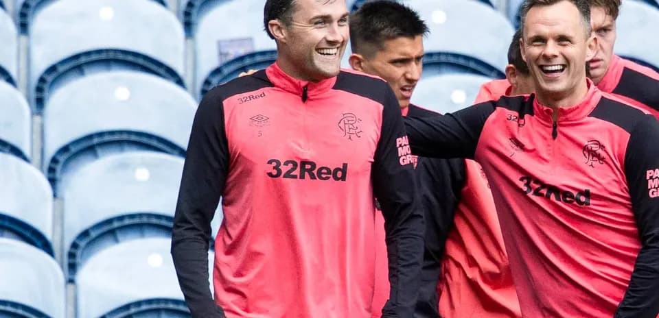 Players smiling during training session at stadium