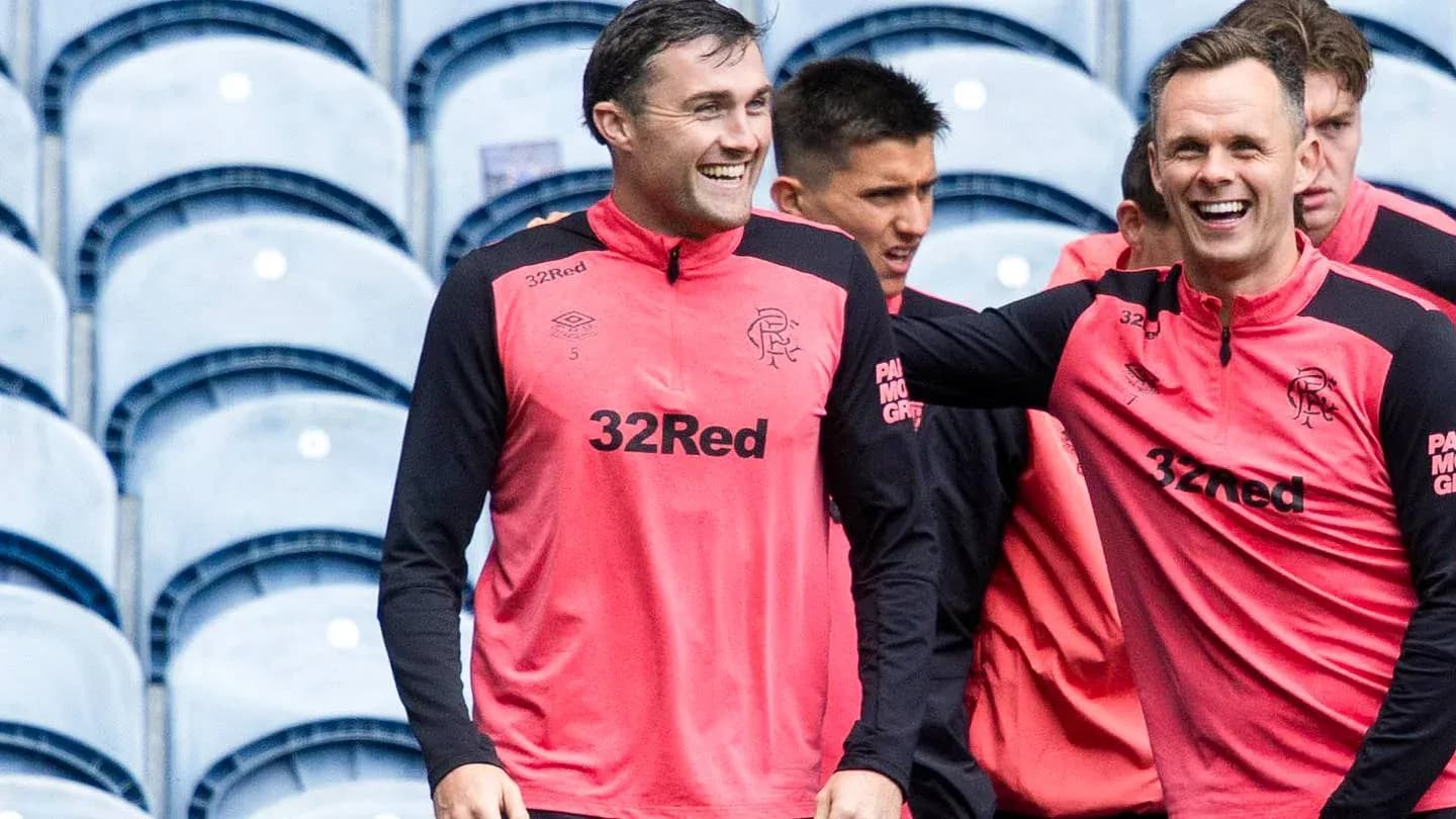 Players smiling during training session at stadium