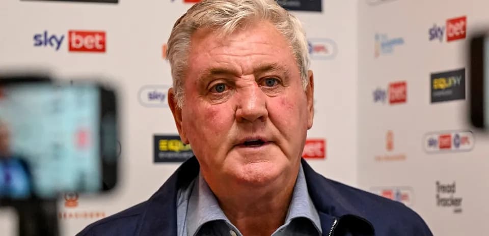 Manager speaking at press conference with logos in background