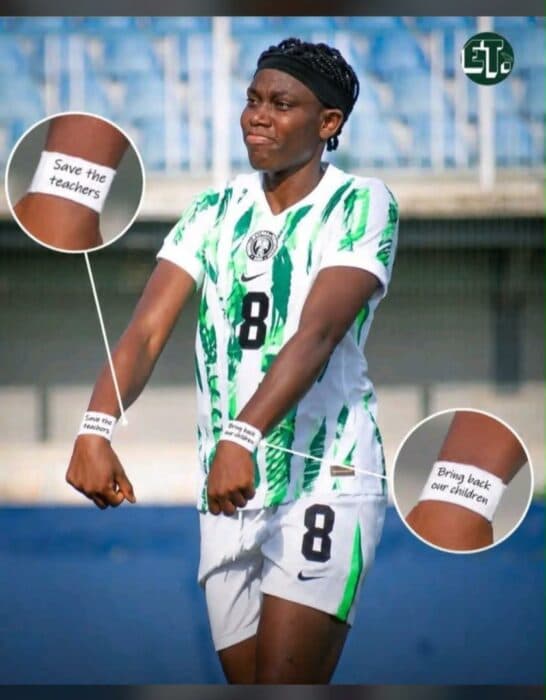 Football player displaying wristbands with messages