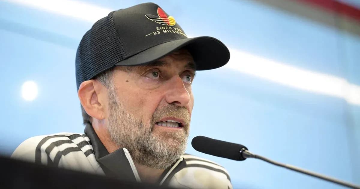 Manager speaking at press conference with microphone