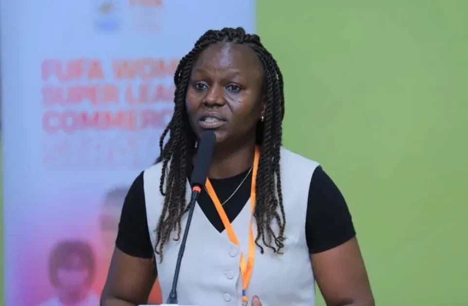Woman speaking at FUFA Women Super League event