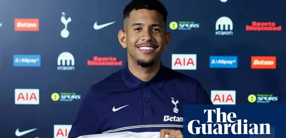 Player holding Tottenham Hotspur shirt at presentation